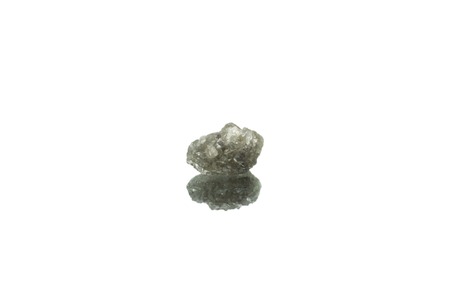 Rough diamond stone isolated on mirror with reflectionの写真素材