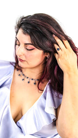 Elegant young woman with luxurious jewelry with sparkling sapphiresの写真素材