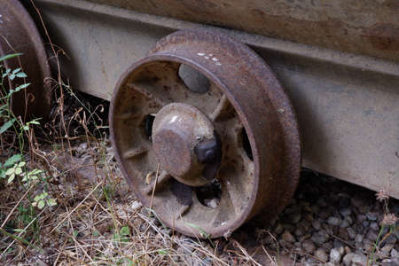 Old abandoned rusty damaged wagon wheelの写真素材