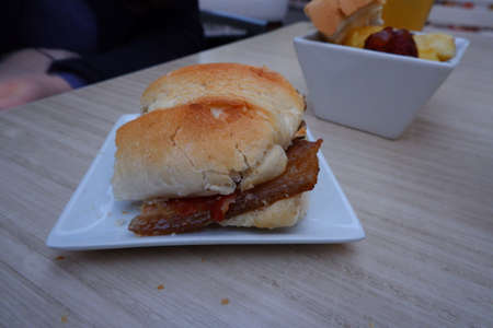 Fried bacon sandwich in a restaurantの写真素材
