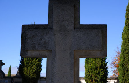 Old cross made of marble in a cemeteryの写真素材