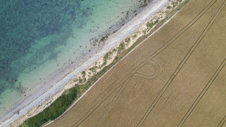 Blue sea and beautiful coastline with small wavesの写真素材