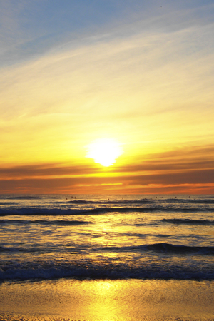sunset at piha beach, new zealandの写真素材