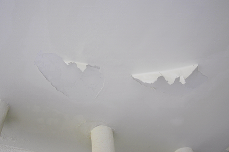 paint falling off from ceiling plasterの写真素材