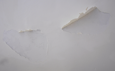 paint falling off from ceiling plasterの写真素材