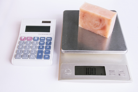 Weighing a bar of handmade soapの写真素材