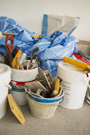 plastic cement buckets with other construction toolsの写真素材