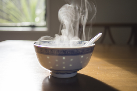 steam from a bowl of hot soupの写真素材