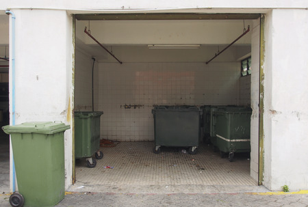 Green garbage containers in garbage roomの写真素材