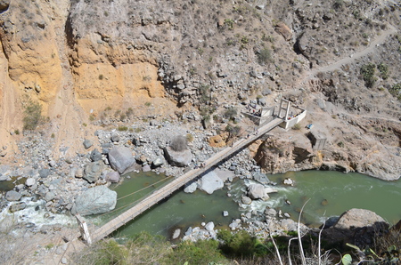 Bridge crossing the river on bottom of Colca Canyon - Aerial Perspectiveの写真素材