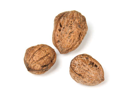 Raw walnuts isolated against white background