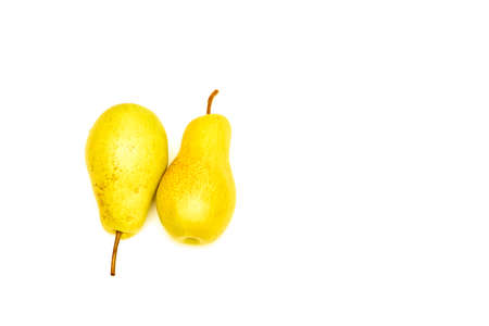Two yellow ripe pears on an isolated white backgroundの写真素材