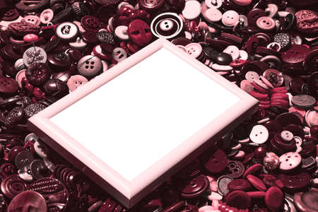 White diagonal frame for text on the background of matte pale red buttonsの写真素材