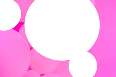 Three white balloons on a background of pink balloons.の写真素材