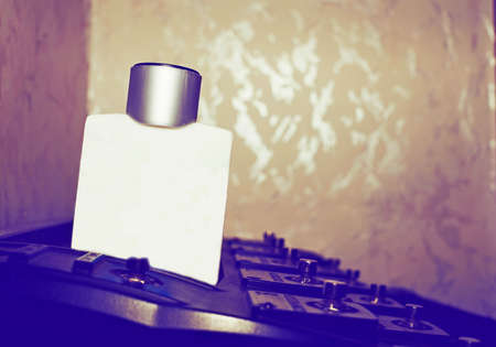 Two plastic bottles vial for oils, perfumes on a dark background