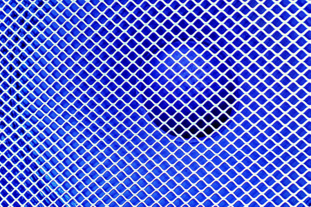 Large music loudspeaker covered with a metal protective mesh on blueの写真素材