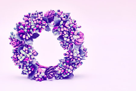 Artificial purple pink blue wreath with leaves cones berries isolatedの写真素材