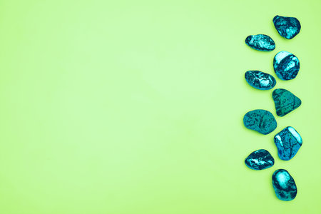 Green background space for advertising text and emerald shiny stones gemsの写真素材