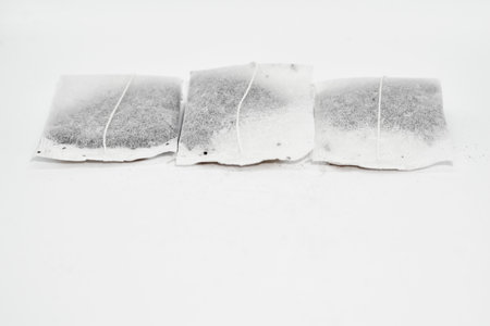 Three useful tea bags for brewing and drinking isolated on whiteの写真素材