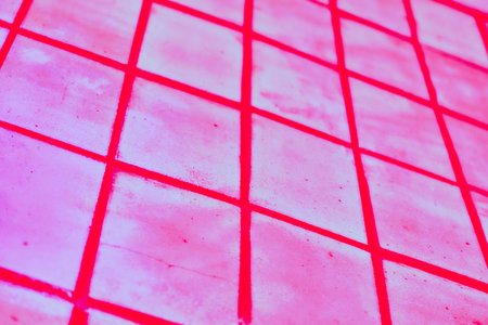 Red pink checkered tiled abstract background wallの写真素材