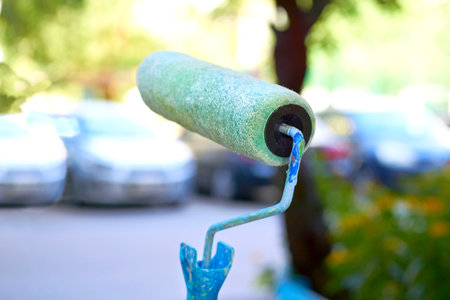 Work roller for painting various surfaces close up on the streetの写真素材
