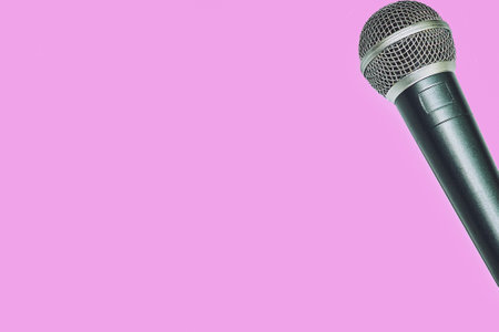 Vocal microphone for singing karaoke isolated on pink magentaの写真素材