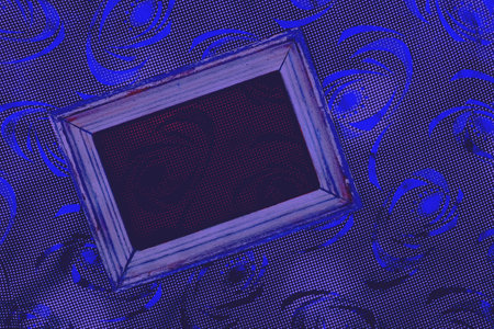 Old wooden frame with dark red center on abstract dotted surface with blue linesの写真素材