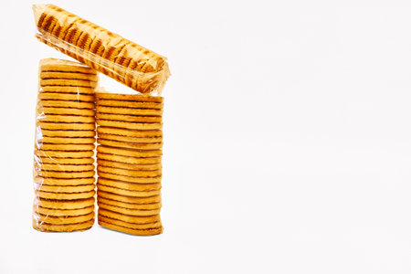 Delicious sweet cookies in a protective cellophane package for sale on a whiteの写真素材