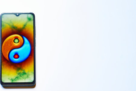 Yin yang Tao sign in mobile cellphone with a on white