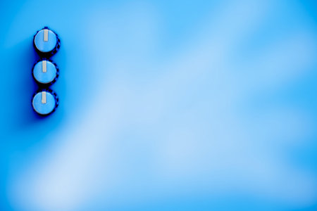 Blue amplifier mixer buttons on blue cloud backgroundの写真素材