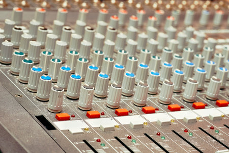 Mixing console for controlling the volume, frequencies of musical instruments