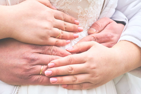 Hands of newlyweds with wedding rings, wedding, bride and groomの写真素材