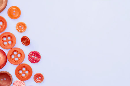 Tailor. Assorted red tailor's buttons for clothes on white