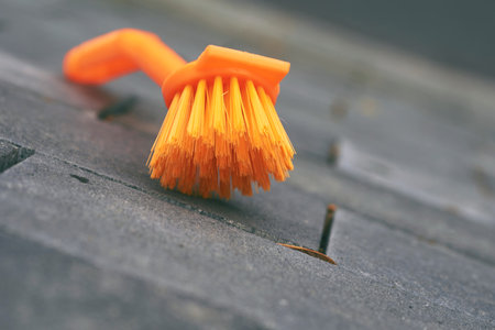 an implement consisting of a sponge or a bundle of thick loose strings attached to a handleの写真素材