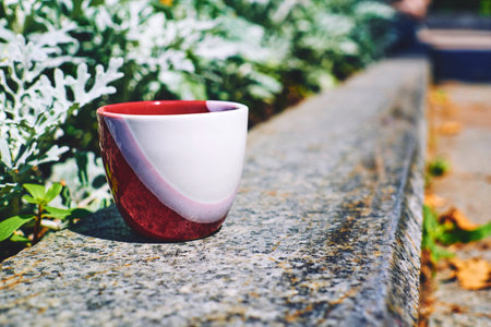 a small bowl shaped container for drinking from, typically having a handleの写真素材