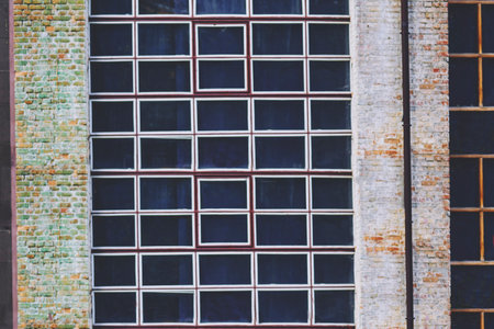 an opening in the wall or roof of a building or vehicle that is fitted with glassの写真素材