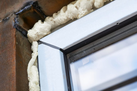 an opening in the wall or roof of a building that is fitted with glassの写真素材