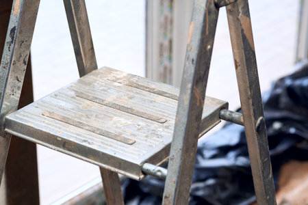 a short folding ladder with flat steps and a small platformの写真素材