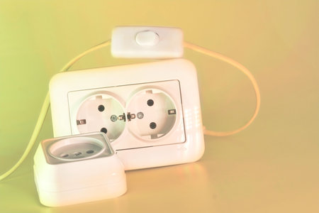 able to be connected by means of a plug. an electrical device receiving a plug or light bulb to make a connectionの写真素材