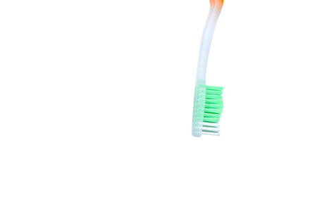 a small brush with a long handle, used for cleaning the teethの写真素材