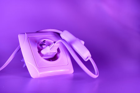 able to be connected by means of a plug. an electrical device receiving a plug or light bulb to make a connectionの写真素材