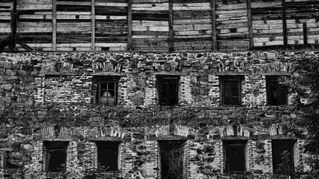 a structure with a roof and walls, such as a house, school, store, or factoryの写真素材