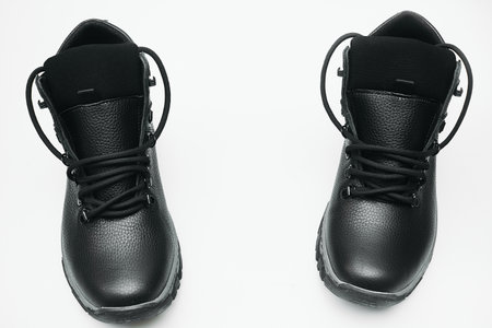 a covering for the foot, typically made of leather, having a sturdy sole and not reaching above the ankleの写真素材