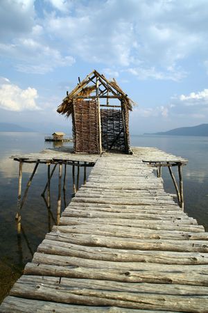 Fishermen`s village with houses made of cane and wooden docks in southern Europe.の写真素材