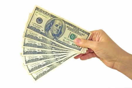Dollars in hand at white background