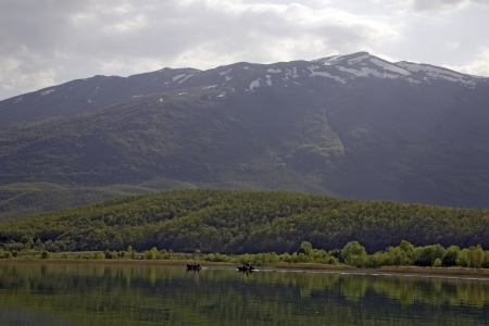 Boats are sailing on tranquil lake in Macedoniaの写真素材