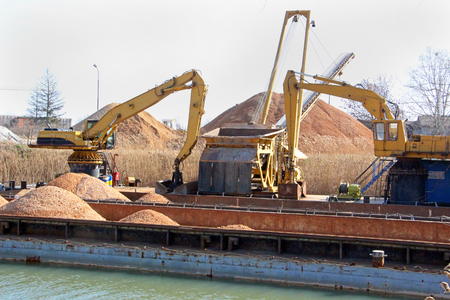 Loading of sand and gravel in river portの写真素材