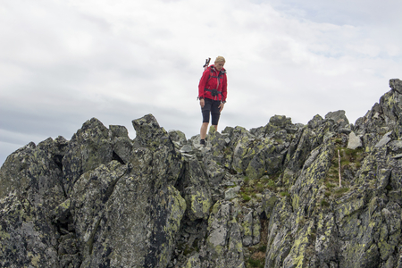 Girl is walking on the edge of abyss - Slovakian mountainsの写真素材