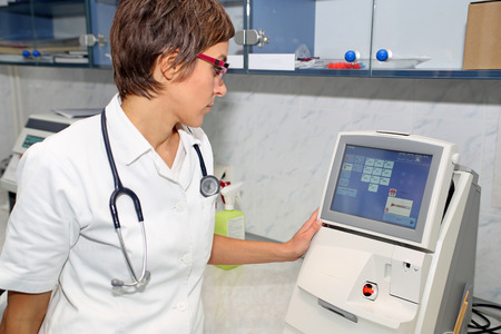 Doctor use equipment for blood gases analysis at laboratoryの写真素材