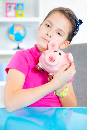 child with piggy bankの写真素材